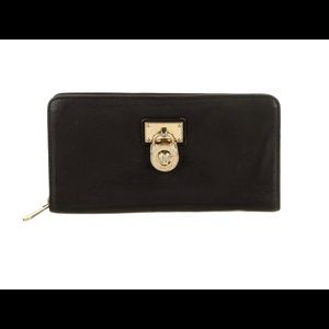 Black and Gold Michael Kors Zipper wallet.